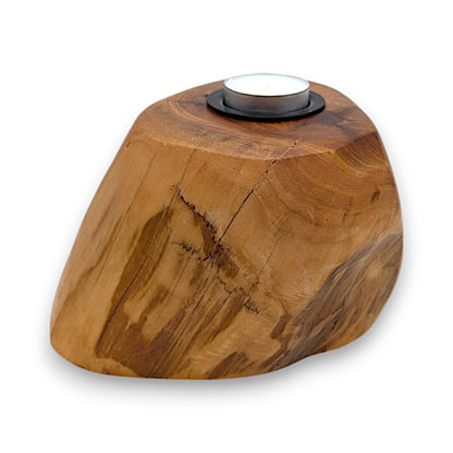 Wooden tea light candle holder with rustic charm and elegant design.