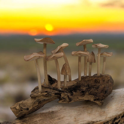 Indonesian carved wood mushroom set with unique grain patterns on a rustic surface.